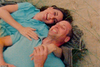 Catherine and William hug each other on a picnic blanket in an adorable moment from the video