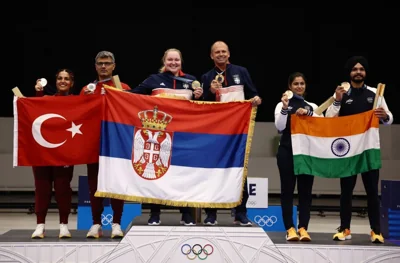 Paris 2024 Olympics - Shooting - 10m Air Pistol Mixed Team Gold Medal - Chateauroux Shooting Centre, Deols, France - July 30, 2024. Silver medallists Sevval Ilayda Tarhan of Turkey and Yusuf Dikec of Turkey, Gold medallists Zorana Arunovic of Serbia and Damir Mikec of Serbia, and Bronze medallists Manu Bhaker of India and Sarabjot Singh of India pose with their flags. REUTERS/Amr Alfiky