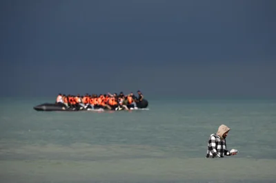 Migrants attempt to cross the English Channel, on the beach of the Slack dunes in Wimereux 