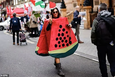 One demonstrator wears a watermelon costume in solidarity with Palestinians on Saturday