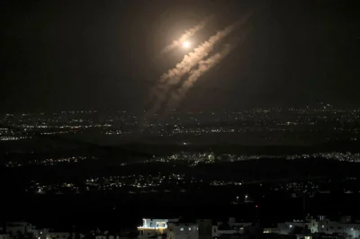 This picture taken from the West Bank city of Hebron shows projectiles above the Israeli city of Ashdod on October 1