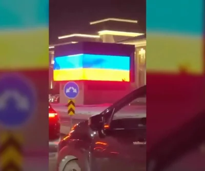 Dozens of cars drove past the flag of Russia's fearless enemies