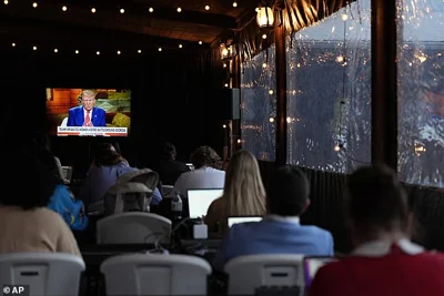 Reporters watch as Republican presidential nominee former President Donald Trump speaks during a Fox News town hall with Harris Faulkner at The Reid Barn, Tuesday, Oct. 15, 2024