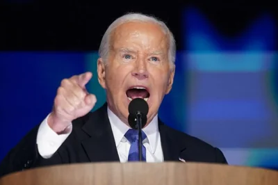 Joe Biden speaks into a microphone at the DNC