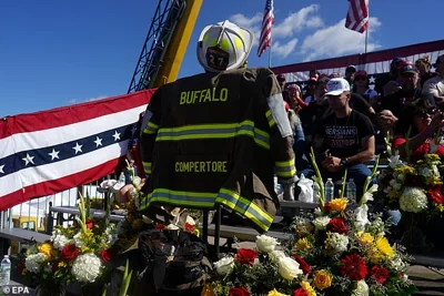 A memorial for firefighter Corey Comperatore, who died during an assassination attempt on Republican presidential nominee and former US president Donald Trump, on display ahead of a campaign rally with President Trump at the Butler Farm Show in Butler, Pennsylvania