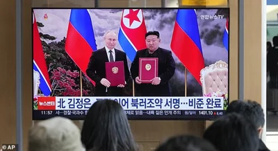 South Koreans watch Kim Jong Un and Vladimir Putin during a recent meeting