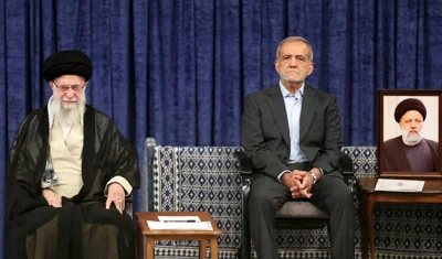 A handout picture provided by the Iranian supreme leader Ayatollah Ali Khamenei office shows, Khamenei (left), and president elect Masoud Pezeshikan (right) during the new president endorsement ceremony in Tehran on July 28, 2024. AFP PHOTO /KHAMENEI.IR
