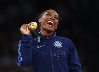 US gymnast Simone Biles celebrating her gold medal at this year's Paris Olympics. Photograph: Naomi Baker/Getty Images