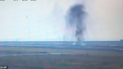 Footage shows the blast spewing pieces of tarmac into the air like a fountain