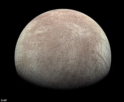 One of Jupiter's 95 known moons, Europa is encased in an ice sheet estimated to be 10 to 15 miles or more thick