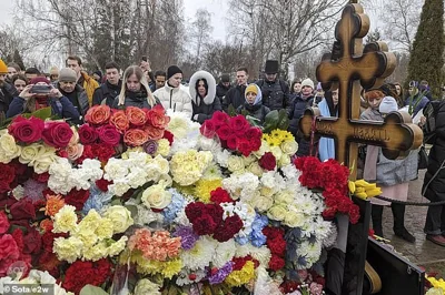 Flowers laid out at Navalny's grave in Moscow after his sudden death aged 47