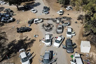 This aerial picture shows abandoned and torched vehicles at the site of the October 7 attack on the Supernova desert music Festival by Palestinian militants near Kibbutz Reim in the Negev desert in southern Israel on October 13, 2023