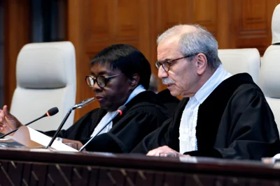 Judge and President of the International Court of Justice (ICJ), Nawaf Salam (R) delivers a non-binding ruling on the legal consequences of the Israeli occupation of the West Bank and East Jerusalem