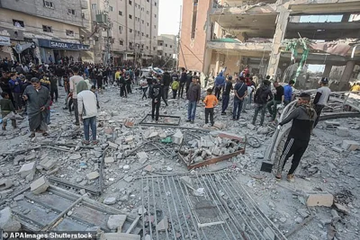 Palestinians search through rubble of Al-Faruq Mosque that was destroyed during Israeli air strike on Nusairat camp in central of Gaza Strip, on 23 November 2024