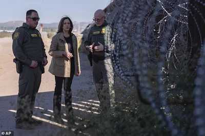 During Saturday's rally Trump added that Harris could never be forgiven for 'erasing our border.' Pictured, arris, center, talks with John Modlin, the chief patrol agent for the Tucson Sector of the U.S. Border Patrol on Saturday