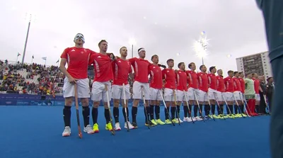 Great Britain's men's team stand together respectfully as the national anthem was played before a hockey match versus Spain
