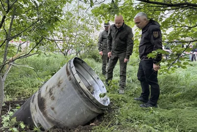city officials examine a fragment of a missile after the Russian missile attack that killed several people, and wounded multiple others in Odesa, 29 April 2024