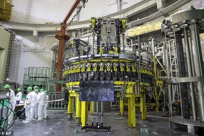 In this Friday, August 7, 2020 file photo, personnel work to begin loading nuclear fuel at Belarus' first nuclear plant which was built by Russia's state nuclear corporation Rosatom, near Astravets, Belarus