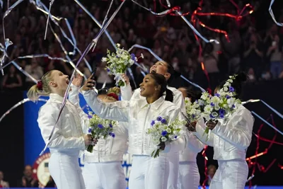 The women celebrate as the 2024 team is named for the Paris Olympics at the United States Gymnastics Olympic Trials on Sunday, June 30, 2024, in Minneapolis. AP PHOTO