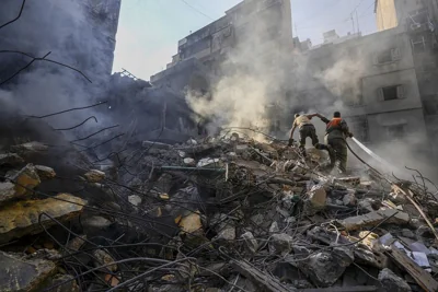 Rescue workers search for victims at the site of an Israeli airstrike on Beirut, 11 October, 2024