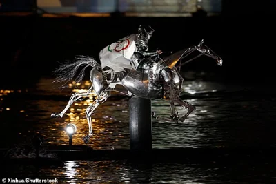 A dramatic end to the ceremony saw a mechanical horse and rider gallop up the Seine