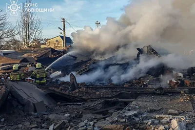 In this photo provided by the Ukrainian Emergency Service, emergency services personnel work to extinguish a fire following a Russian rocket attack in Lviv, Ukraine, Sunday, Nov. 17, 2024. (Ukrainian Emergency Service via AP)