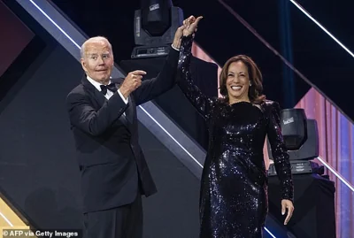 US President Joe Biden welcomes Vice President and Democratic presidential candidate Kamala Harris to the stage during the 2024 Phoenix Awards Dinner at the Washington Convention Center in Washington, DC, on September 14, 2024