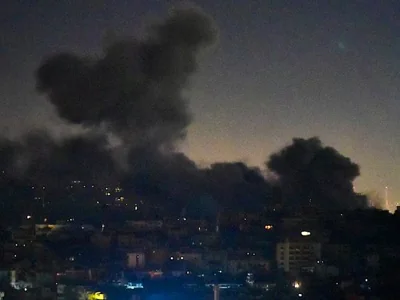 Smoke rises from areas targeted by an Israeli airstrike in Beirut’s southern suburbs