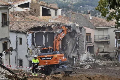 A view of the demolition works at a damaged house after flash floods in Letur, province of Albacete, Spain