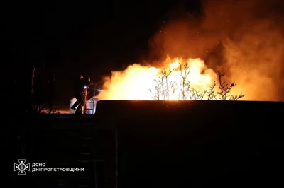 Rescue workers putting out a fire after a Russian strike on Dnipro