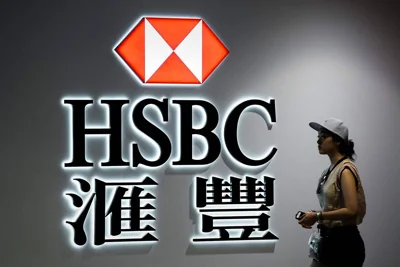 STEPPING DOWN A woman walks past a logo of the HSBC bank in Hong Kong on August 3, 2015. The lender said on Tuesday, April 30, 2024, its CEO Noel Quinn will be retiring after five years at the helm. AFP PHOTO