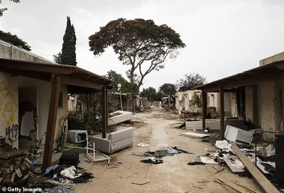 A street in kibbutz Kfar Aza is seen on October 27 - 20 days after Hamas stormed the area