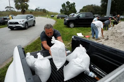 Florida residents prepare sandbags in preparation of the arrival of Hurricane Milton