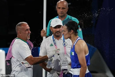 Khelif's coach Mohamed Chaoua (center) is adamant that his fighter is indeed a woman