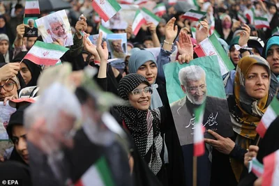 Supporters of Iranian presidential hardliner candidate Saeed Jalili cheer during an election campaign in Tehran, Iran, 24 June 2024