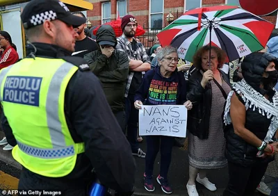 Protestors gather outside the Abdullah Quillam Mosque in Liverpool on Friday