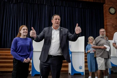 Leader of the Democratic Alliance (DA) South African main opposition party John Steenhuisen (C) reacts before casting his ballot at the Northwood School polling station in Durban North, Durban, on May 29, 2024, during South Africa's general election. - South Africans vote on May 29, 2024 in what may be the most consequential election in decades, as dissatisfaction with the ruling ANC threatens to end its 30-year political dominance. (Photo by GIANLUIGI GUERCIA / AFP)