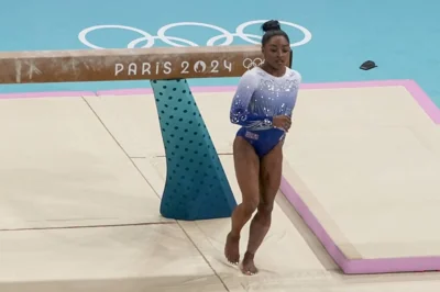 Simone Biles, of the United States, falls on the beam during the women's artistic gymnastics individual balance beam finals in Bercy Arena at the 2024 Summer Olympics, Monday, Aug. 5, 2024, in Paris, France. AP PHOTO