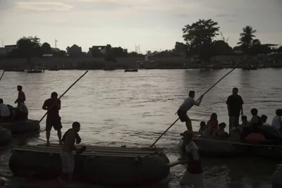 Migrants on rafts at Mexico Guatemala border