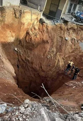 The site of an impact crater following Israel's assault on Hezbollah HQ in Dahiyeh, Beirut