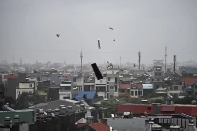 IDENTIFIED FLYING OBJECTS Debris flies in the air as heavy rain and high winds from Super Typhoon Yagi lash the city of Hai Phong, northeastern Vietnam, on Sept. 7, 2024. AFP PHOTO