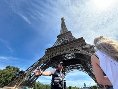 Police evacuate the area around the Eiffel Tower after a man was seen climbing the historic landmark