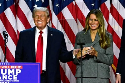 Former US President and Republican presidential candidate Donald Trump and former US First Lady Melania Trump smile after speaking during an election night event at the West Palm Beach Convention Center in West Palm Beach, Florida, early on November 6, 2024. AFP PHOTO