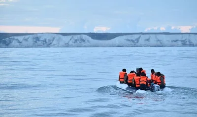 Migrants on a dinghy in the English Channel