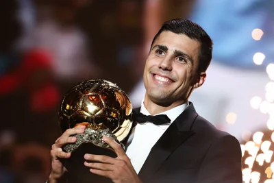 Rodri poses with the trophy after winning the Ballon d’Or