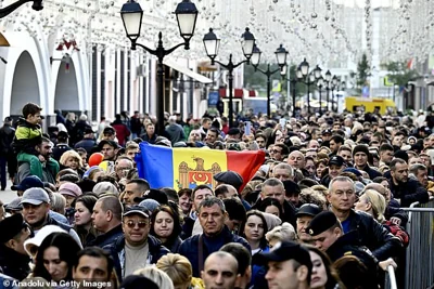 Moldovan citizens living in Moscow are seen queuing to vote at a polling station during the 2024 Moldovan elections