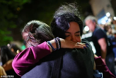 Last night tearful fans hugged each other as they gathered and lit candles outside the hotel where Liam's body was found