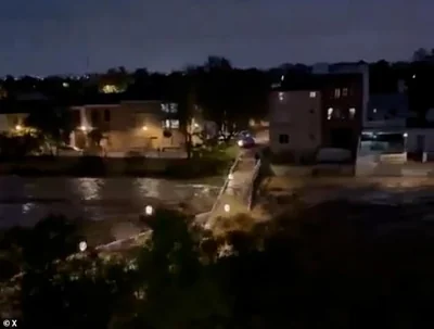 Paiporta bridge in the town of the same name was left completely devastated as the river beneath burst its banks and continued to rise