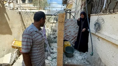 A woman reacts as Palestinians inspect the site of an Israeli strike on a house, amid Israel-Hamas conflict, in Gaza City August 12, 2024.(REUTERS)