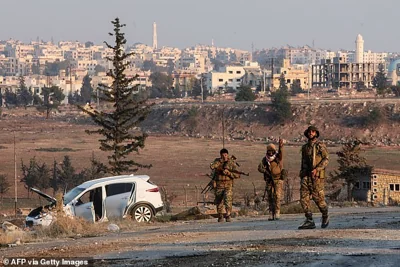 Anti regime fighters hold a position on the outskirts of the northern Syrian city of Aleppo on November 29